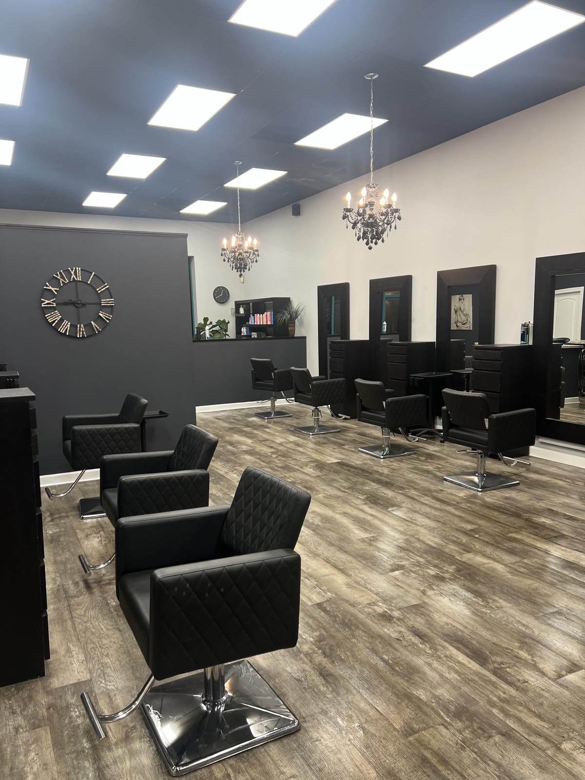 Interior of the styling floor with black salon chairs